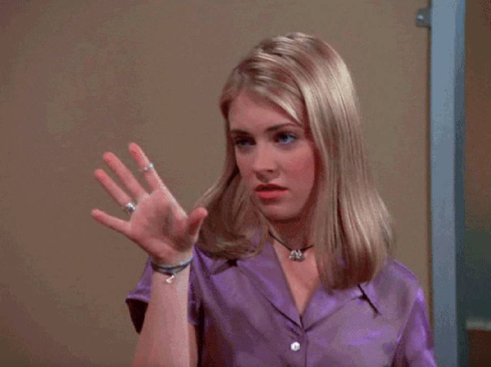 Woman gestures with her hand, portraying Kelly Bundy from "Married... with Children"