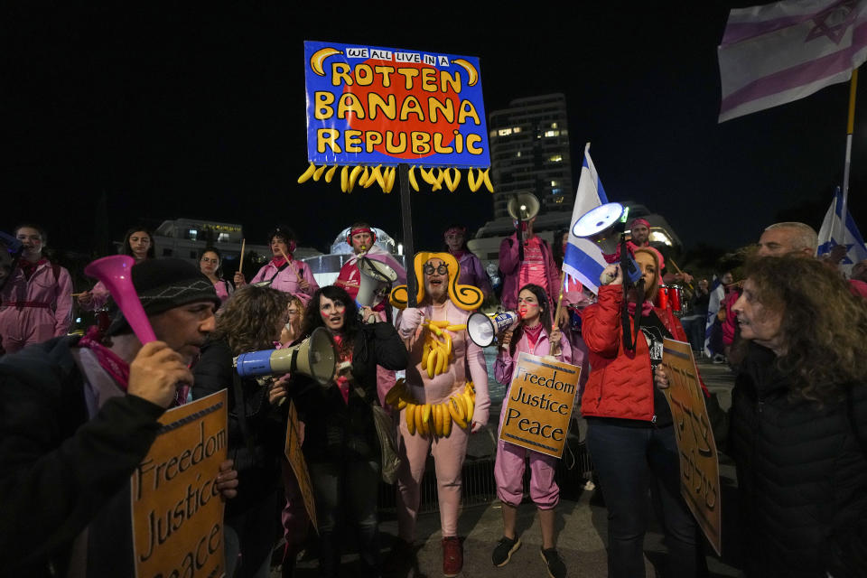 Israelis protest against plans by Prime Minister Benjamin Netanyahu's new government to overhaul the judicial system, in Tel Aviv, Israel, Saturday, Feb. 18, 2023. (AP Photo/Tsafrir Abayov)