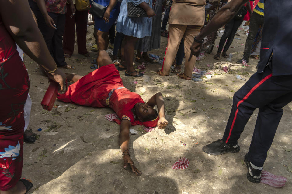 FILE - A Vodouist invokes a gede spirit, family of Iwa, during the Saint George celebration in Port-au-Prince, Haiti, April 24, 2024. Vodou has a single God known as “Bondye,” Creole for “Good God,” and more than 1,000 spirits known as the lwa — some that aren’t always benevolent.(AP Photo/Ramon Espinosa, File)