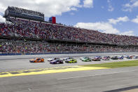 NASCAR Cup Series driver Joey Logano (22) leads the pack to the green flag during the Geico 500 NASCAR Sprint Cup auto race at Talladega Superspeedway Sunday, April 25, 2021 in Talladega, Ala. (AP Photo/Butch Dill)