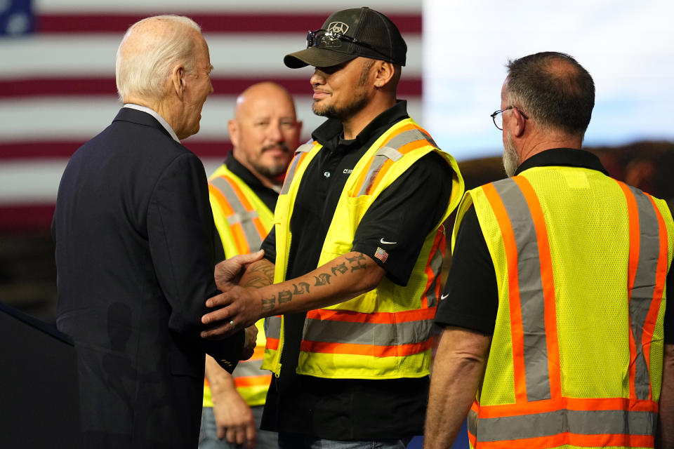 President Joe Biden greets workers after speaking at CS Wind, Wednesday, Nov. 29, 2023, in Pueblo, Colo. (AP Photo/Jack Dempsey)