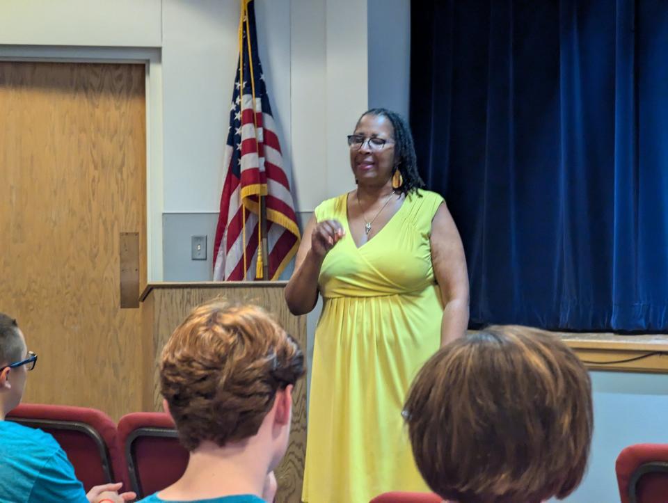 Cassandrea Tucker, president of the Fremont Chapter of the NAACP, speaks Thursday at the Hayes Presidential Center as part of the observance of Juneteenth.