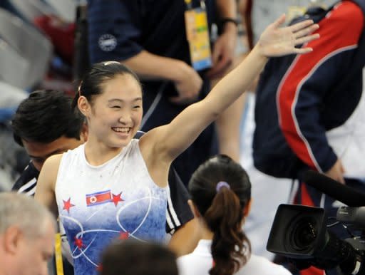 North Korea's Un Jong-Hong waves to spectators after winning the gold in the women's vault final of the artistic gymnastics event of the Beijing 2008 Olympic Games. In Beijing, N.Korea won two gold, one silver and three bronze medals to finish in 34th place overall