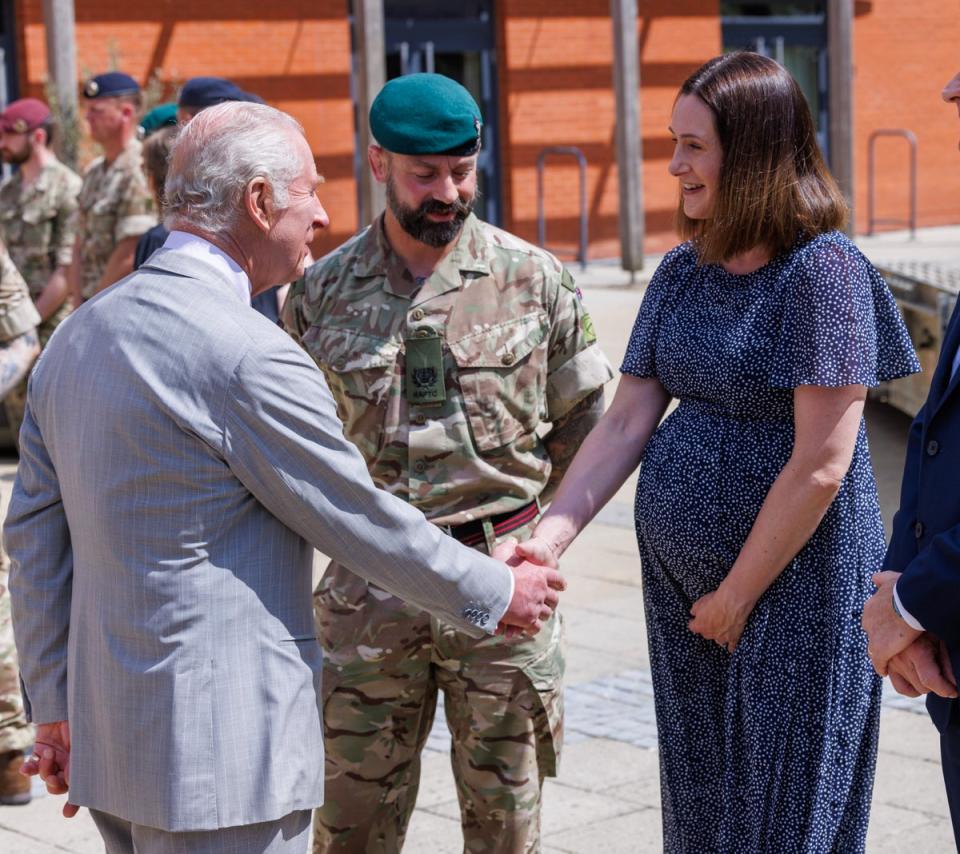 King Charles speaks to Sophie Mairs during a visit to Gibraltar Barracks in Minley (Jonathan Buckmaster/Daily Express/PA Wire)