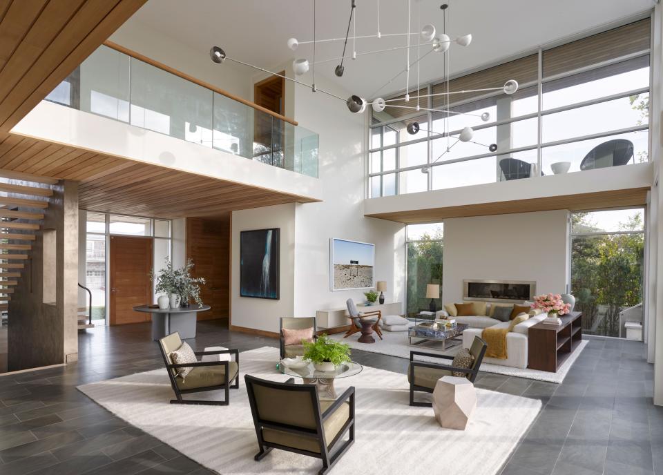 In the expansive living room, there is no shortage of glass or natural light.