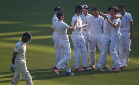 Cricket - India v England - Fourth Test cricket match - Wankhede Stadium, Mumbai, India - 10/12/16. England's Jake Ball (2nd R) celebrates with team mates the wicket of India's Cheteshwar Pujara. REUTERS/Danish Siddiqui