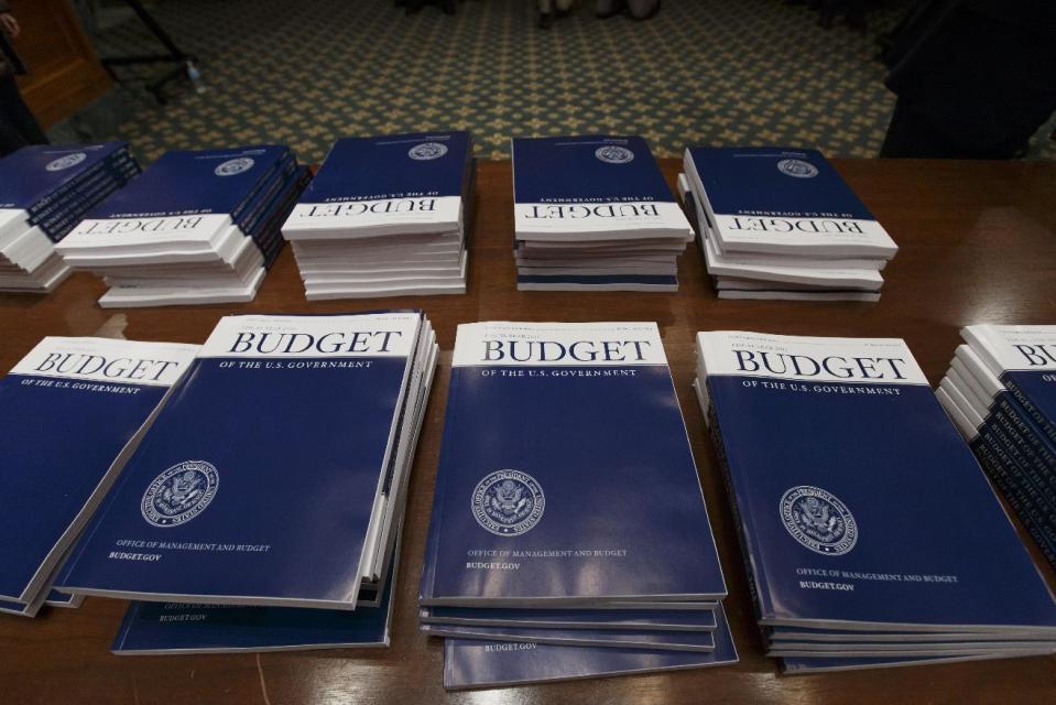 Copies of President Barack Obama’s proposed fiscal 2015 budget are set out for distribution by the Senate Budget Committee on Capitol Hill in Washington, Tuesday, March 4, 2014. President Barack Obama is unwrapping a nearly $4 trillion budget that gives Democrats an election-year playbook for fortifying the economy and bolstering Americans' incomes. It also underscores how pressure has faded to launch bold, new attacks on federal deficits. (AP Photo/J. Scott Applewhite)