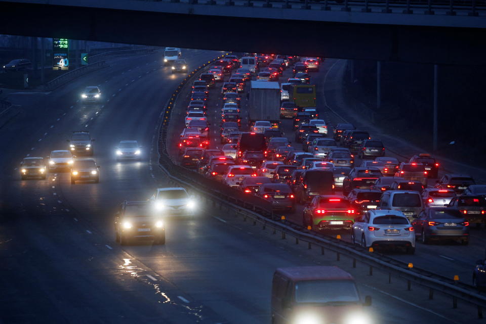 Cars drive towards the exit of the city after Russian President Vladimir Putin authorized a military operation in eastern Ukraine, in Kyiv, Ukraine February 24, 2022. REUTERS/Valentyn Ogirenko