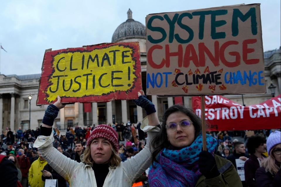 Climate change protesters gather in Trafalgar Square  (AFP via Getty Images)