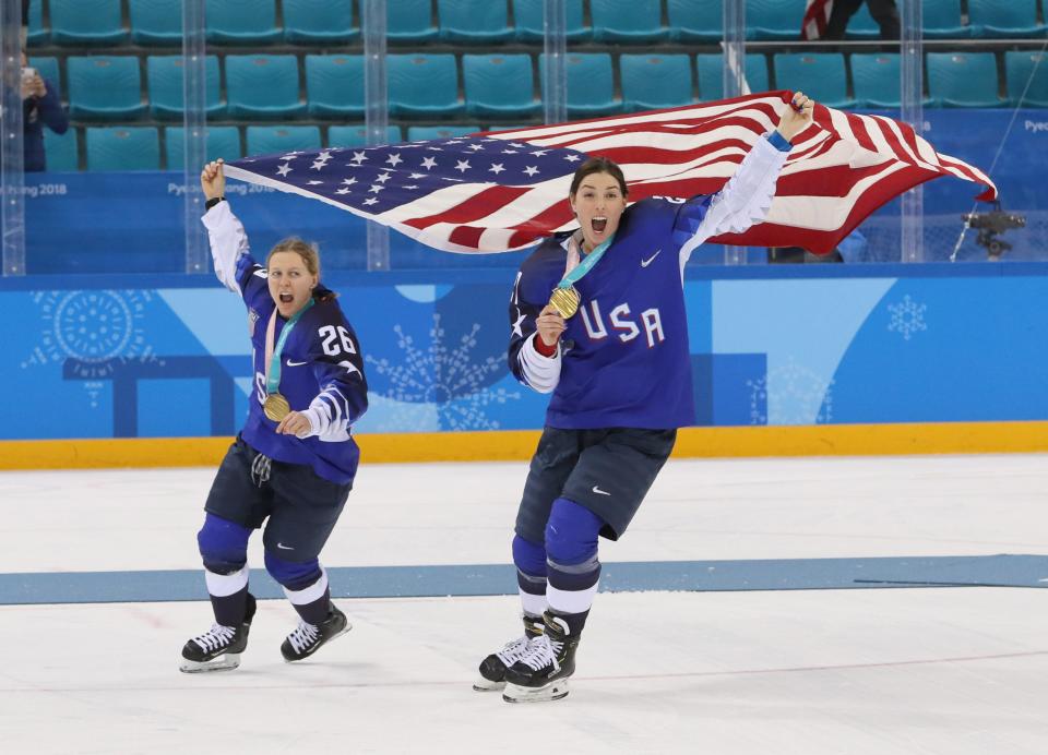 United States forward Kendall Coyne (26) and forward Hilary Knight (21) celebrate after defeating Canada in the women's ice hockey gold medal match during the Pyeongchang 2018 Olympic Winter Games at Gangneung Hockey Centre.