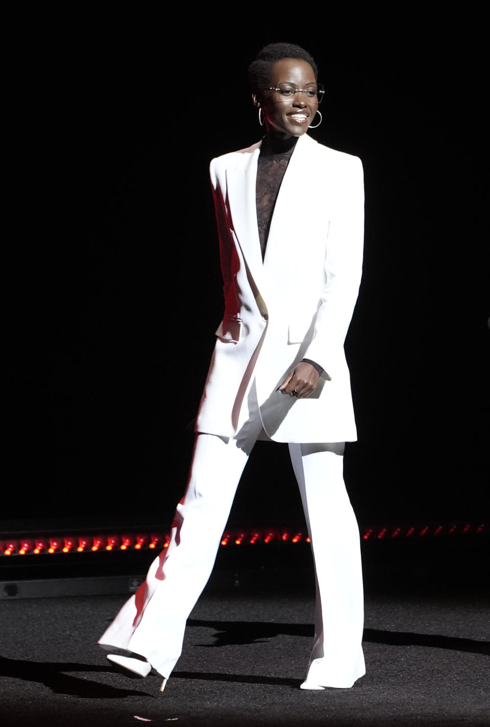 Lupita Nyong'o, a cast member in the upcoming film "A Quiet Place: Day One," walks onstage during the Paramount Pictures presentation at CinemaCon 2024, Thursday, April 11, 2024, at Caesars Palace in Las Vegas. (AP Photo/Chris Pizzello)