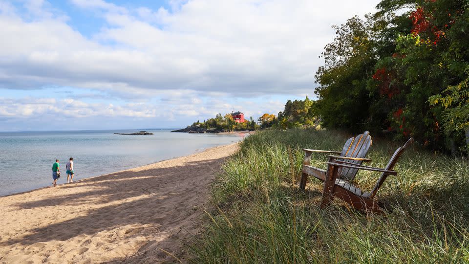 The shores of Lake Superior in Marquette, Michigan, with Harbor Lighthouse in the background. - soupstock/Adobe Stock