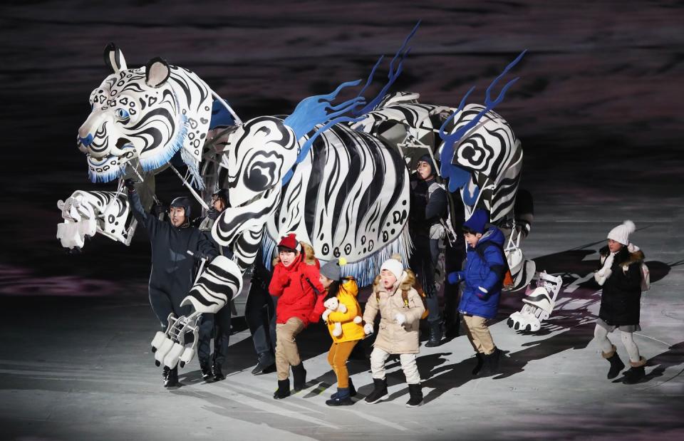 <p>Five children walked alongside a white tiger, the protector of Korea and the mascot of the Pyeongchang Games. </p>