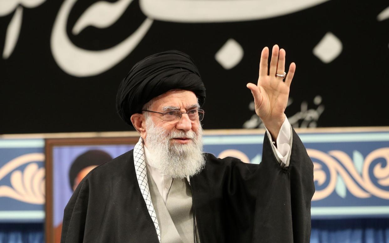 Iranian Supreme Leader Ayatollah Ali Khamenei greets participants during a meeting in Tehran - Anadolu