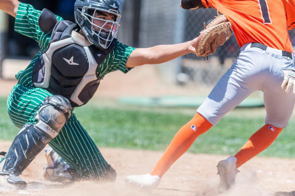Victor Valley's Dominic Dominguez tags out Apple Valley's Eric Logsdon at the plate in the all-star baseball game at Hesperia High School on Saturday, June 4, 2022.