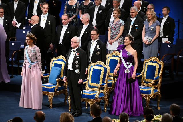 <p>JONATHAN NACKSTRAND/AFP via Getty</p> Queen Silvia, King Carl XVI Gustaf and Crown Princess Victoria at the Nobel Prize Awards ceremony on Dec. 10.
