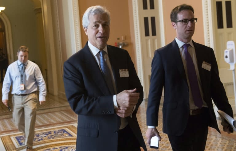 Jamie Dimon (C), President and CEO of JPMorgan Chase -- shown here on Capitol Hill -- criticized the violence in Charlottesville, but signaled no plans to exit White House advisory panels