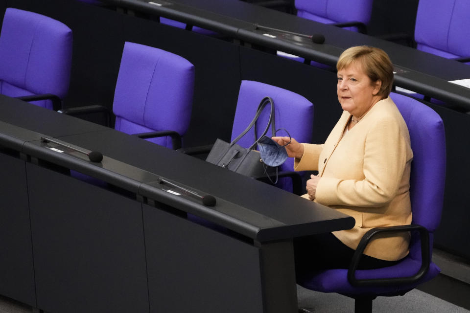 German Chancellor Angela Merkel arrives for a debate about the situation in Germany ahead of the upcoming national election in Berlin, Germany, Tuesday, Sept. 7, 2021. National elections scheduled in Germany for Sept. 26, 2021.(AP Photo/Markus Schreiber)