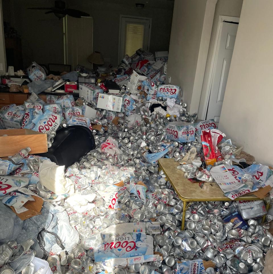 a hoarder home in Florida with Coors Light cans