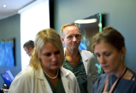 Professor Mats Brannstrom (C), head of a medical team which performed its first uterus transplant on a patient, attends a news conference about the procedure at the Sahlgreska University Hospital in Gothenburg September 18, 2012. REUTERS/Adam Ihse/TT News Agency