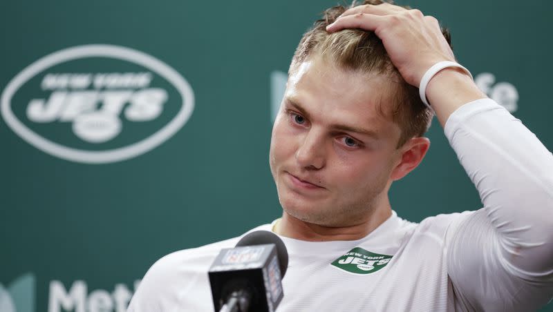 New York Jets quarterback Zach Wilson (2) answers questions during a news conference after an NFL football game against the New England Patriots, Sunday, Sept. 24, 2023, in East Rutherford, N.J.
