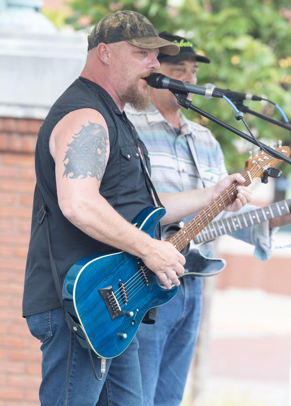 Matt Dowdy, left, and Tom Lerch, perform at the Downtown Canton Music Fest at Centennial Plaza.
