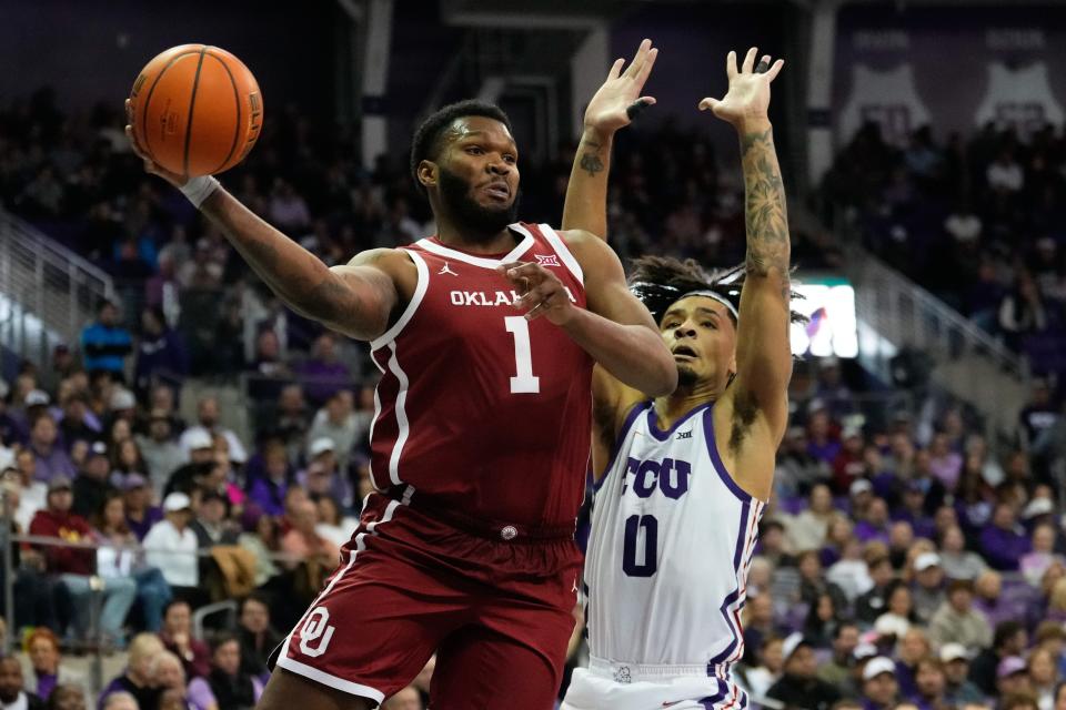 Jan 10, 2024; Fort Worth, Texas, USA; Oklahoma Sooners forward John Hugley IV (1) looks to pass against TCU Horned Frogs guard Micah Peavy (0) during the second half at Ed and Rae Schollmaier Arena. Mandatory Credit: Chris Jones-USA TODAY Sports