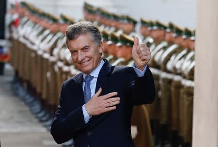 Argentina's president Mauricio Macri acknowledges the media during a meeting with Chile's President Michelle Bachelet at the government house as a part of his official visit in Santiago, Chile June 27, 2017. REUTERS/Rodrigo Garrido TPX IMAGES OF THE DAY