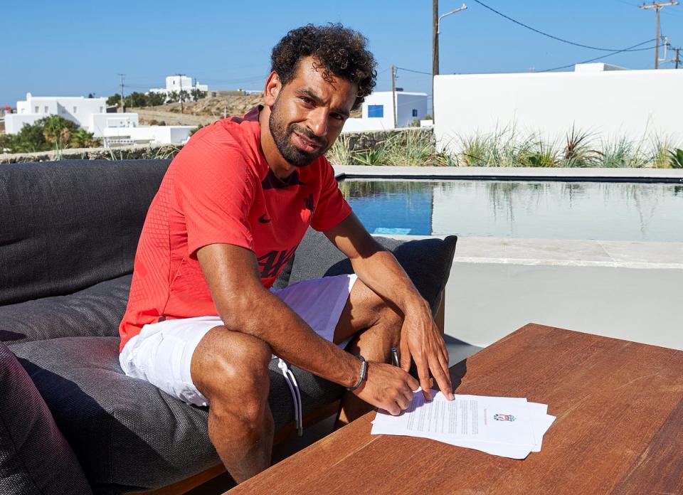 Salah has penned a new deal with the Reds  (Liverpool FC via Getty Images)