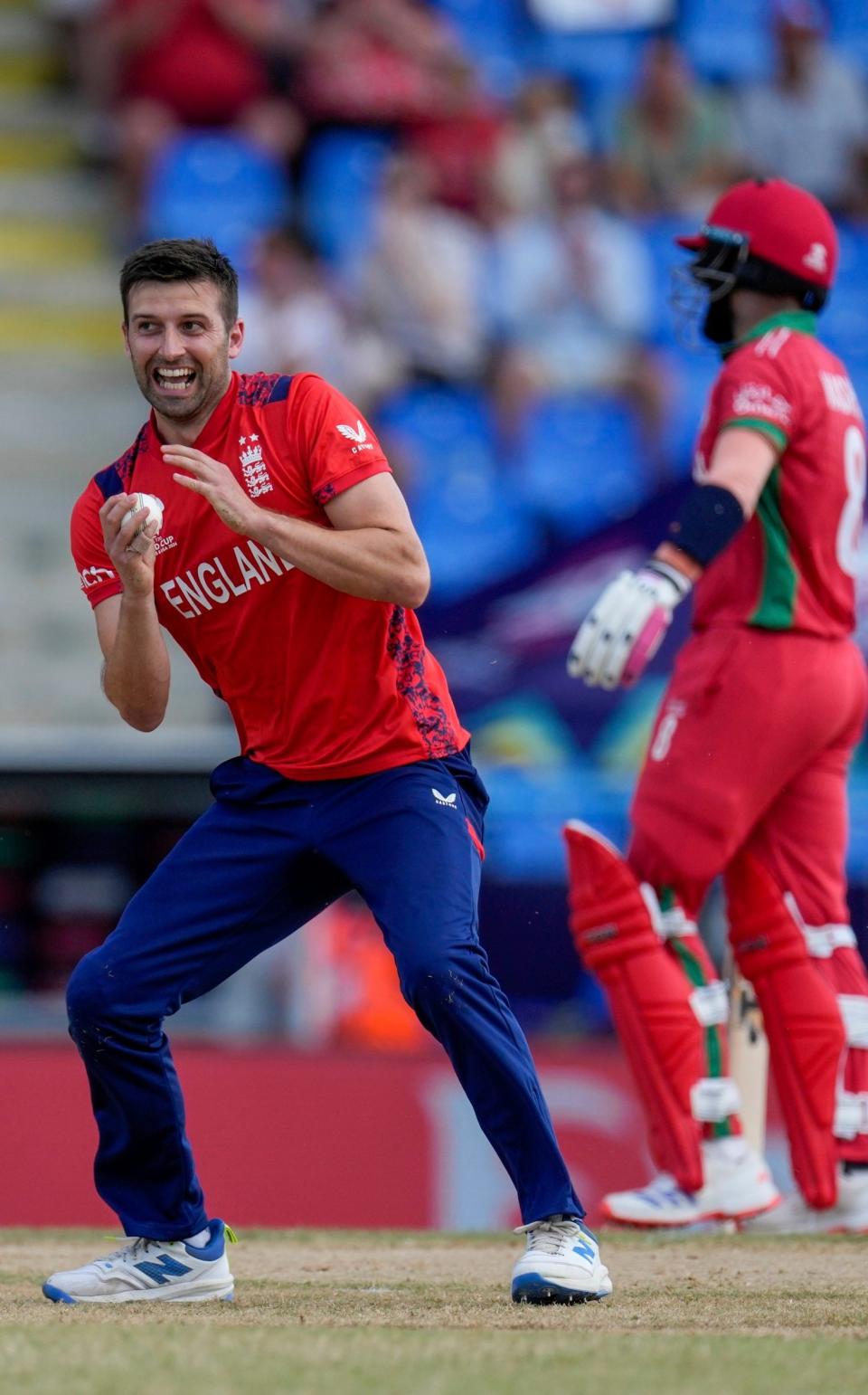 Mark Wood celebrates the first of his three wickets.