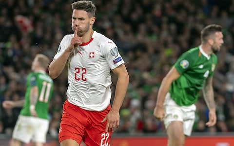 Newcastle defender Fabian Schar opened the scoring for the Swiss - Credit: REX