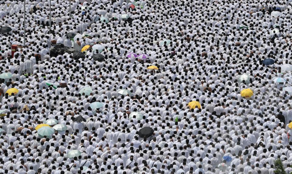 Muslim worshippers, some carrying umbrellas to protect them from the scorching sun, gather for prayer at Namirah mosque near Mount Arafat, also known as Jabal al-Rahmah (Mount of Mercy), where the Prophet Mohammed is believed to have given his final sermon.