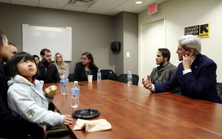 U.S. Secretary of State John Secretary Kerry (R) meets with a group of refugees and staff members at a refugee resettlement center in Silver Spring, Maryland January 13, 2016. REUTERS/Yuri Gripas