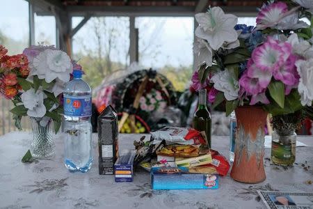 Flowers are placed on a table inside a chapel at a cemetery in the village of Trnovce, Serbia, October 27, 2016. REUTERS/Marko Djurica