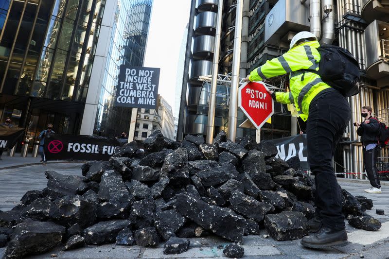 Extinction Rebellion activists protest outside the Lloyd's building in London