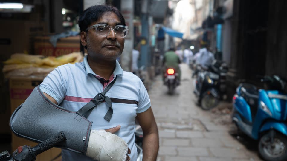 Shamsher Ali worries for his young daughters, who he says are growing up in an increasingly polarized India. His arm was in a cast from a recent traffic accident. - John Mees/CNN