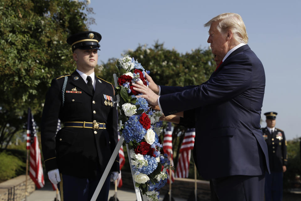 President Donald Trump and first lady Melania Trump place a wreath and will participate in a moment of silence honoring the victims of the Sept. 11 terrorist attacks, Wednesday, Sept. 11, 2019, at the Pentagon. (AP Photo/Evan Vucci)
