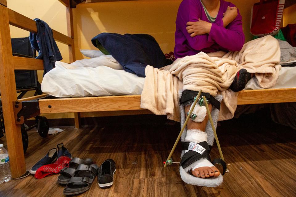 Alma Zavala rests at a migrant shelter in El Paso, Texas, after she broke her fibula after attempting to cross illegally into the U.S. in October.