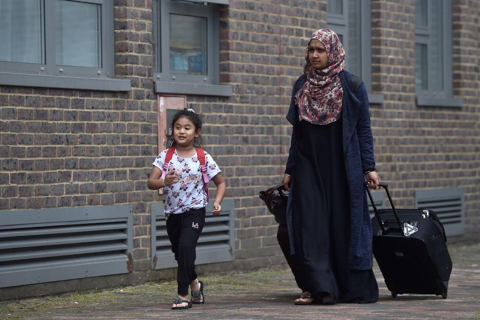 <p>Residents are evacuated from the Dorney Tower residential block as a precautionary measure following concerns over the type of cladding used on the outside of the building on the Chalcots Estate in north London, Britain, June 24, 2017. (Photo: Hannah McKay/Reuters) </p>