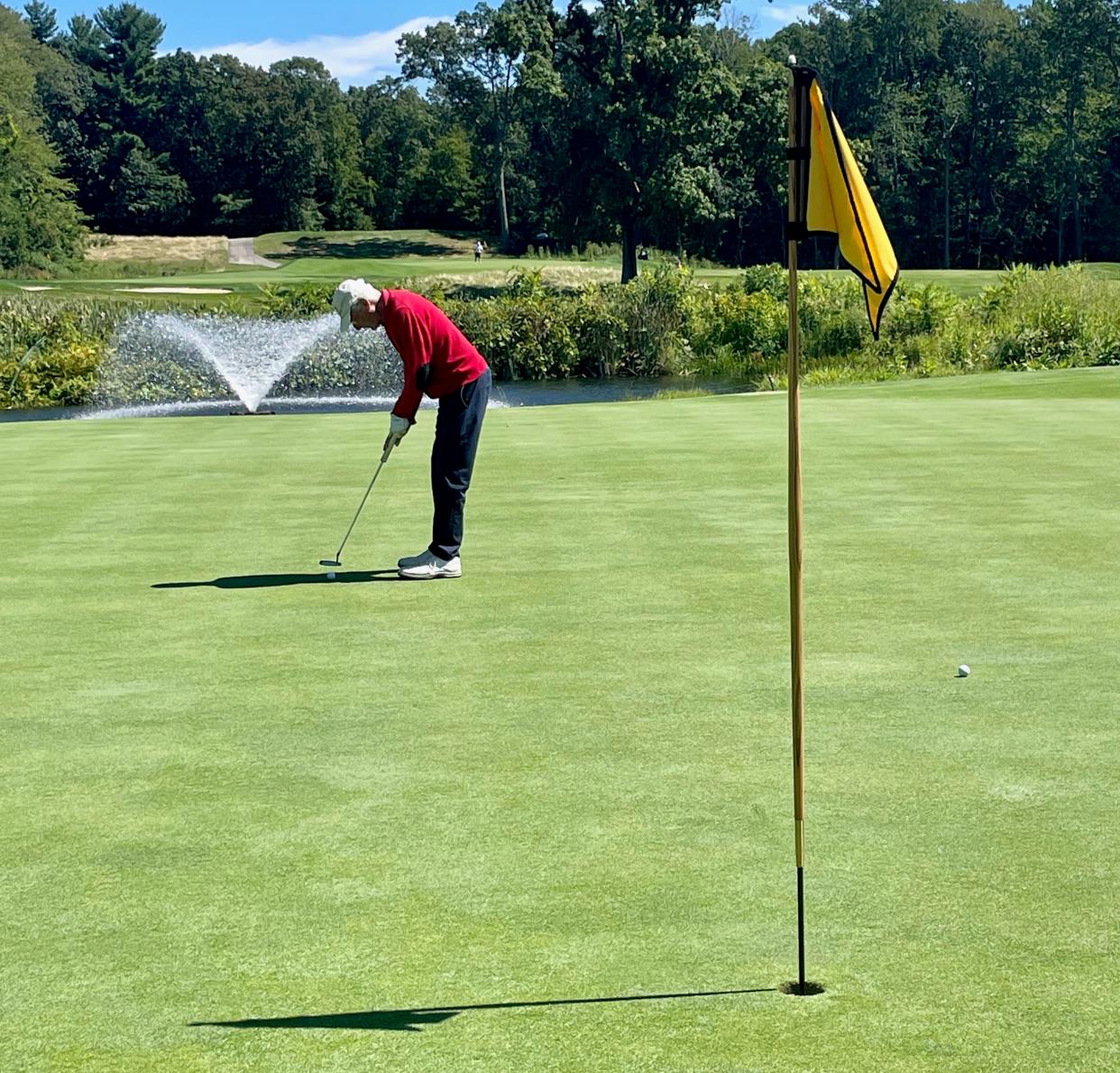 John Peterson putts on the ninth hole at Tatnuck Country Club.