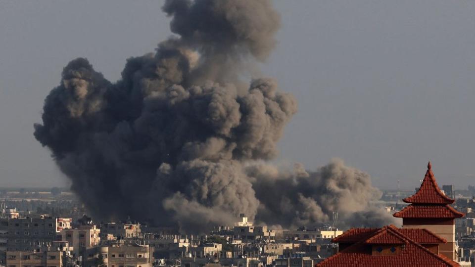 A picture taken from Rafah shows smoke billowing over Khan Younis during Israeli bombardment on January 24, 2024