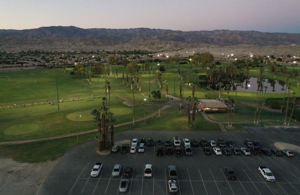 The Lights at Indio Golf Course comes alive when the sun goes down as golfers enjoy the cooler evening temperatures in Indio, Calif., August 4, 2023. 