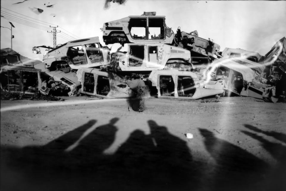 Destroyed Humvess used by the U.S. Army during the war against the Taliban in Afghanistan are stacked to be sold as scrap metal in Kandahar City, Afghanistan, Monday, June 12, 2023. (AP Photo/Rodrigo Abd)