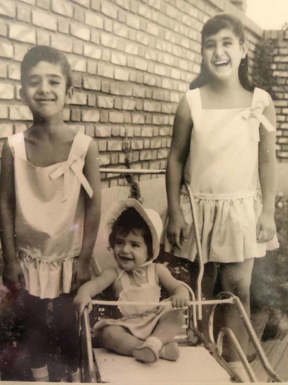 Naghmeh aged 18 months in Iran, pictured centre, with her sister Niloofar, pictured left, her older sister Ladan, pictured right (Collect/PA Real Life).