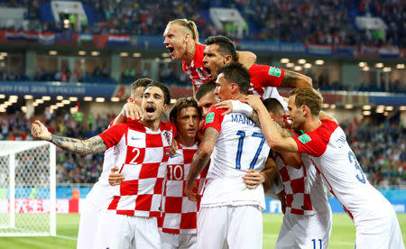 Soccer Football - World Cup - Group D - Croatia vs Nigeria - Kaliningrad Stadium, Kaliningrad, Russia - June 16, 2018 Croatia's Luka Modric celebrates with team mates after scoring their second goal REUTERS/Fabrizio Bensch