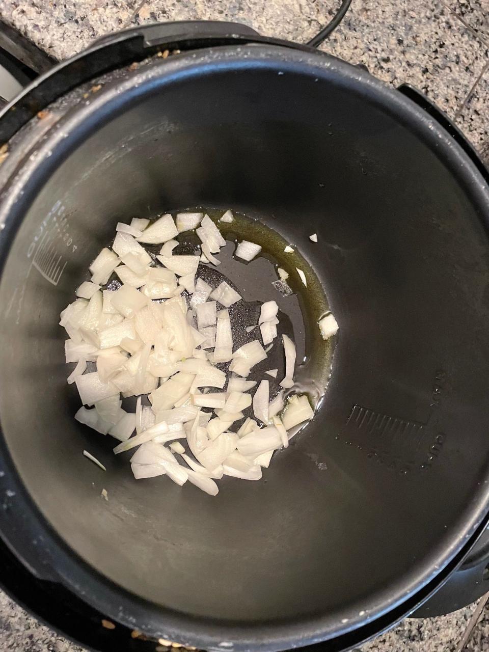 Adding onions for Anneta's Dad's Avgolemono Soup