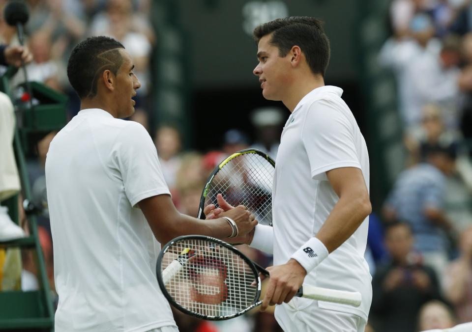 Milos Raonic of Canada, right, shakes hands with Nick Kyrgios of Australia after beating him at Wimbledon last year. (AP Photo/Ben Curtis)