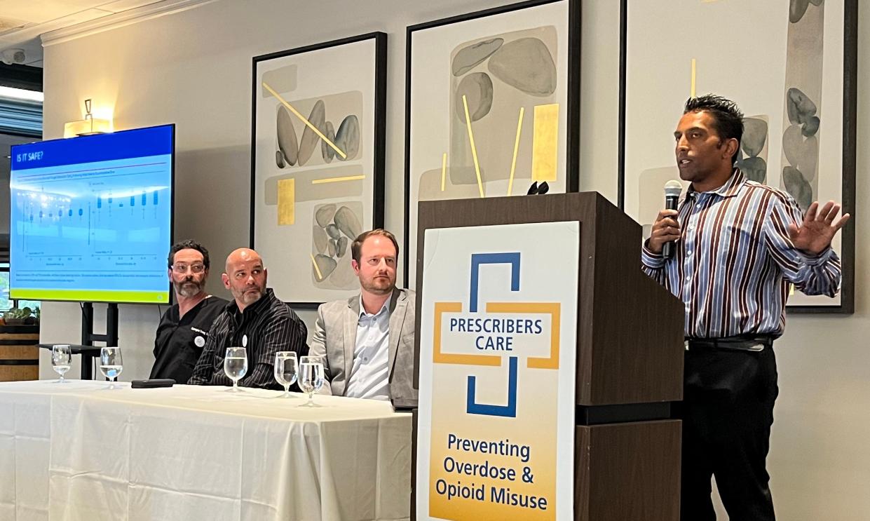 Dr. Tipu Khan, head of the Ventura County Medical Center addiction medicine clinic, speaks during Tuesday's event on preventing and treating opioid addiction. The panel includes Ventura County Medical Examiner Christopher Young, from left Sheriff's Sgt. John Hadjucko, and Dr. Matthew Lamon, an addiction medicine specialist.
