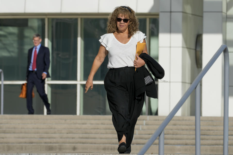 Nancy Marks leaves federal court, Thursday, Oct. 5, 2023, in Central Islip, N.Y. Marks, the ex-campaign treasurer for U.S. Rep. George Santos pleaded guilty Thursday to conspiring to defraud the U.S. government and implicated the indicted New York Republican in court with submitting bogus campaign finance reports. (AP Photo/Mary Altaffer)