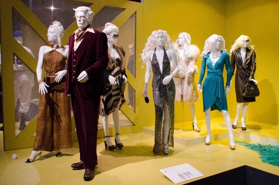 In this Saturday, Feb. 8, 2014 photo, 2014 Oscar nominated costumes for "American Hustle," by costume designer Michael Wilkinson are on display at the 22nd annual Art of Motion Picture Costume Design Exhibit, in Los Angeles, Calif. The Fashion Institute of Design & Merchandising holds its free-to-the-public Art of Motion Picture Costume Design exhibit on view until April 26, 2014, featuring this year's five Oscar nominees: "American Hustle," "The Grandmaster," "The Great Gatsby," "The Invisible Woman" and "12 Years A Slave," in Los Angeles. (Photo by Tonya Wise/Invision/AP)